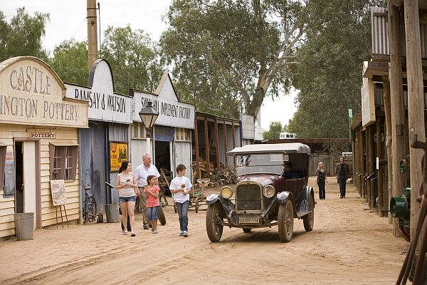 Family in main street of Swan Hill Pioneer Settlement